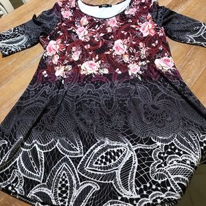 Tunic top with black background.  Never worn.